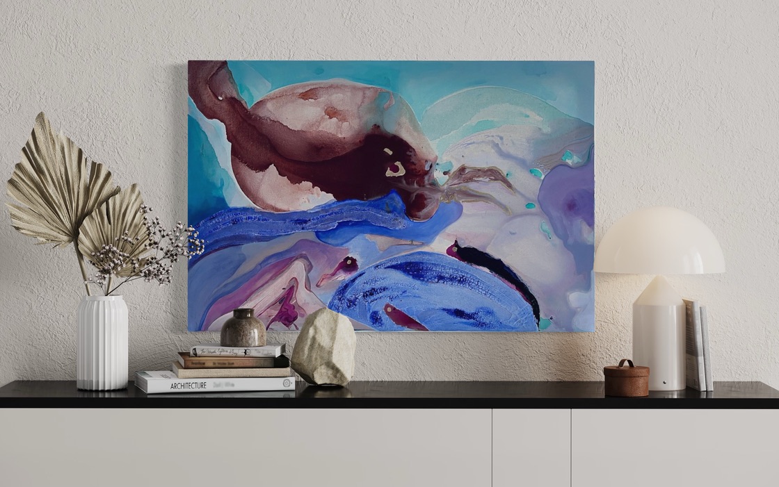 Painting displayed on a credenza with a lamp